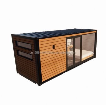 Buiten modern ontwerp uitbreidbare container huis geprefabriceerde houten structuur grote glazen zonnekamer voor gezinsparen hotel